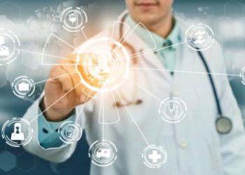 Medical Healthcare Concept - Doctor in hospital with digital medical icons graphic banner showing symbol of medicine, medical care people, emergency service network, doctor data of patient health.