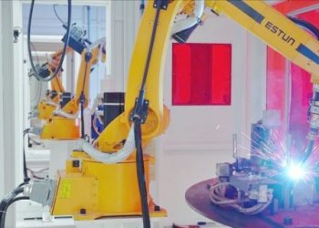 Robots in Luyuan Guigang intelligent factory are assembling products. There are 60 welding robots in the factory now. (PRNewsfoto/The Publicity Department of Gangbei District, Guigang)