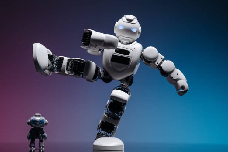 Photo by Pavel Danilyuk from Pexels: https://www.pexels.com/photo/a-white-robot-with-foot-above-a-small-robot-8294618/