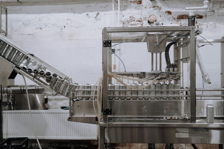 Photo by cottonbro studio: https://www.pexels.com/photo/aluminum-cans-passing-through-the-assembly-line-5532664/