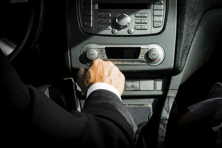 Photo by Mateusz Dach: https://www.pexels.com/photo/man-in-black-suit-inside-car-1135379/