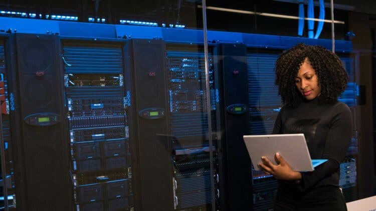 Photo by Christina Morillo from Pexels: https://www.pexels.com/photo/software-engineer-standing-beside-server-racks-1181354/