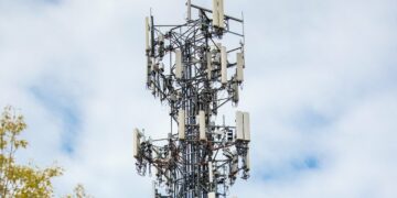 Photo by Caleb Oquendo: https://www.pexels.com/photo/cell-tower-between-trees-under-cloudy-sky-7388500/