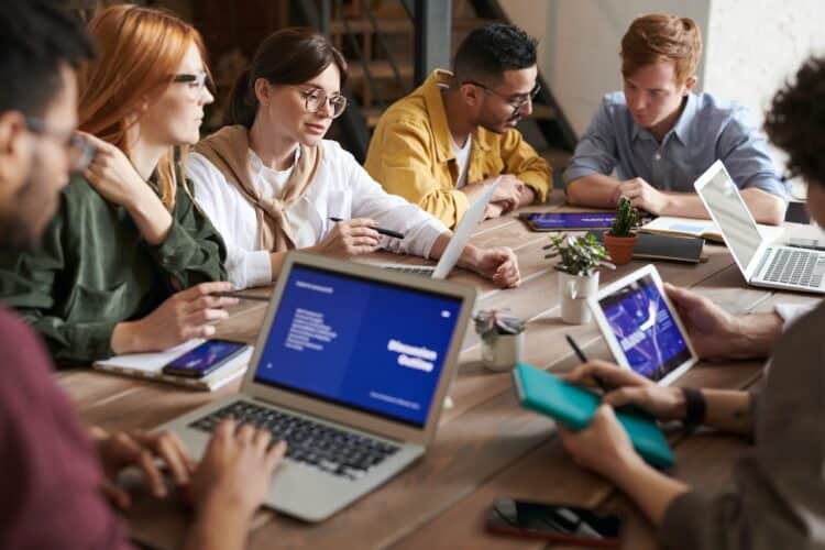 Photo by fauxels: https://www.pexels.com/photo/photo-of-people-leaning-on-wooden-table-3184325/
