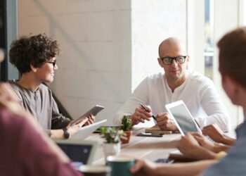 Photo by fauxels: https://www.pexels.com/photo/photo-of-man-sitting-in-front-of-people-3184299/