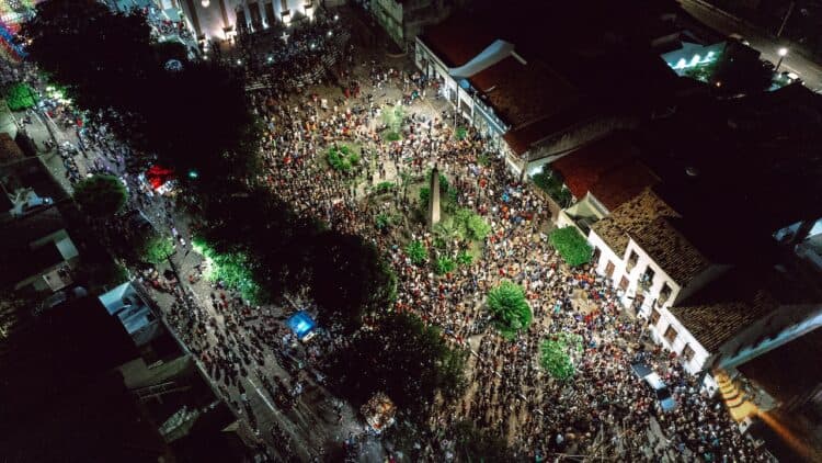 Photo by Luiz  Valber: https://www.pexels.com/photo/aerial-view-of-a-crowded-city-street-during-a-celebration-at-night-15789993/