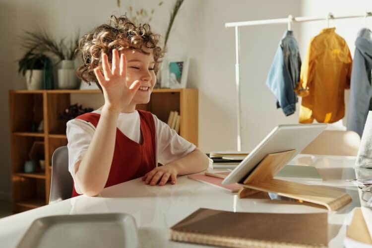 Photo by Julia M Cameron: https://www.pexels.com/photo/photo-of-child-smiling-while-using-tablet-computer-4145032/