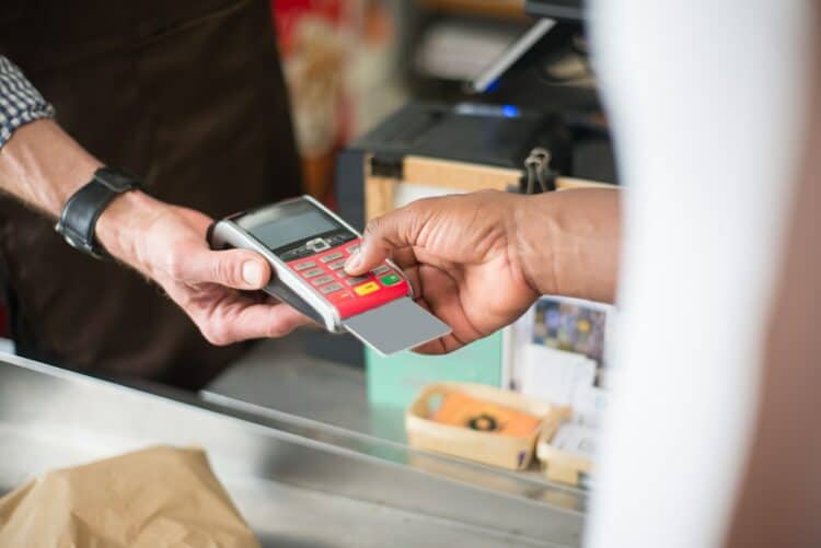 Photo by Kampus Production: https://www.pexels.com/photo/a-person-paying-with-a-bank-card-8475156/