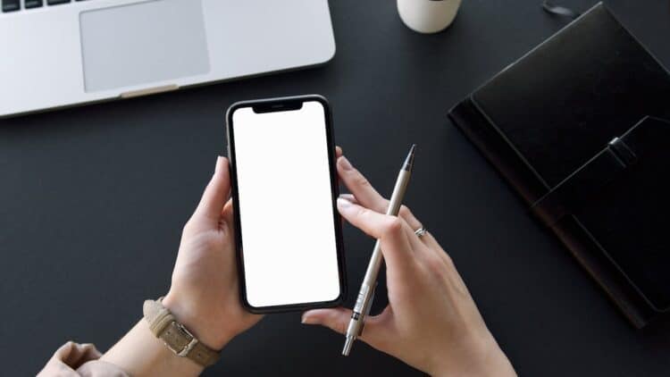 Photo by Artem Podrez: https://www.pexels.com/photo/person-holding-black-iphone-and-pen-6278754/