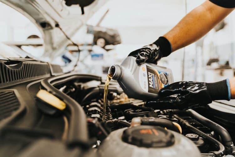 Photo by Daniel Andraski: https://www.pexels.com/photo/pouring-oil-to-engine-13065690/