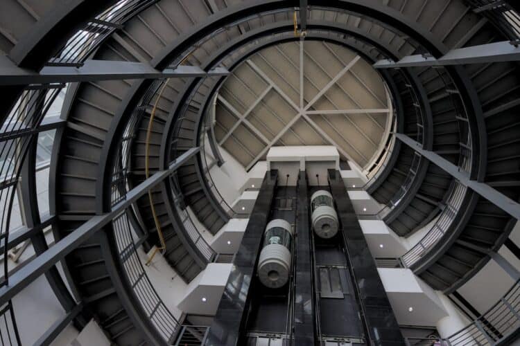 Photo by Kampamba : https://www.pexels.com/photo/spiral-staircase-and-elevators-18533100/