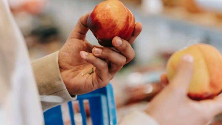Photo by Michael Burrows: https://www.pexels.com/photo/crop-unrecognizable-man-choosing-peach-and-nectarine-in-supermarket-7129150/
