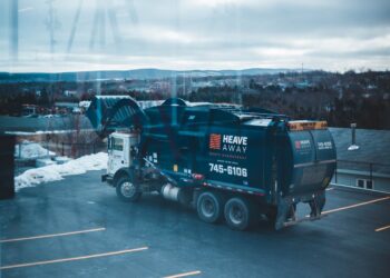 Photo by Erik Mclean: https://www.pexels.com/photo/garbage-truck-parked-in-parking-lot-11115607/