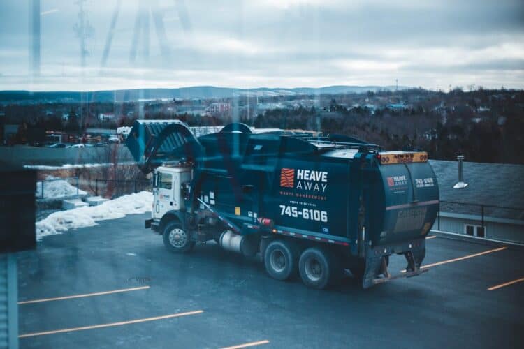 Photo by Erik Mclean: https://www.pexels.com/photo/garbage-truck-parked-in-parking-lot-11115607/