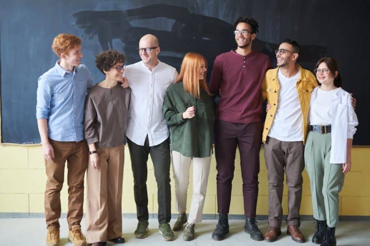 Photo by fauxels: https://www.pexels.com/photo/group-of-people-standing-beside-chalk-board-3184394/