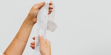 Photo by Karolina Kaboompics: https://www.pexels.com/photo/woman-holding-a-receipt-4959907/