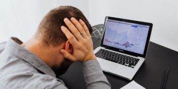 Photo by Karolina Kaboompics: https://www.pexels.com/photo/man-with-laptop-on-desk-terrified-by-stock-market-chart-5717791/