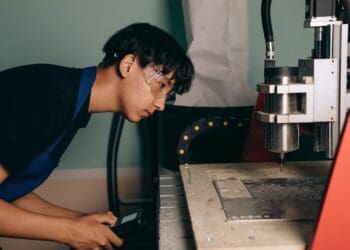 Photo by Mikhail Nilov: https://www.pexels.com/photo/engineer-operating-machine-9242177/