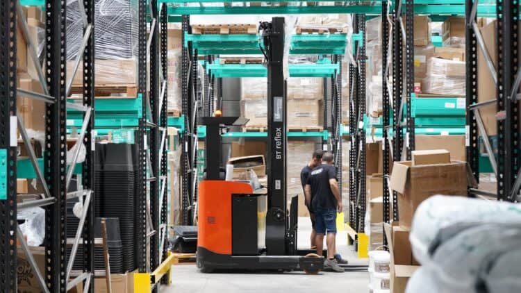 Photo by GB  The Green Brand: https://www.pexels.com/photo/modern-warehouse-operations-with-employees-and-forklift-30824313/