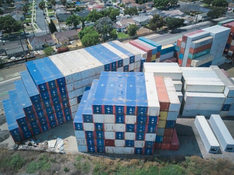 Photo by Kindel Media: https://www.pexels.com/photo/drone-shot-of-stacks-of-cargo-containers-9716376/