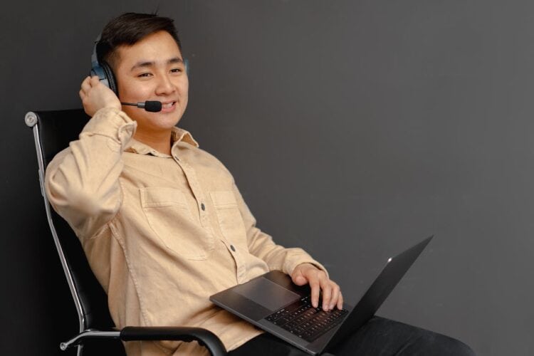 Photo by Mikhail Nilov: https://www.pexels.com/photo/a-man-in-brown-button-up-long-sleeve-shirt-using-a-laptop-7681983/