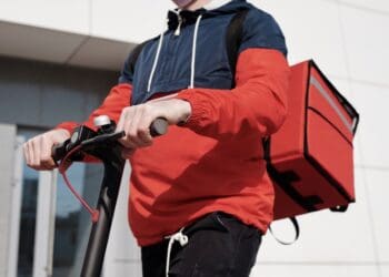 Photo by Norma Mortenson: https://www.pexels.com/photo/man-in-red-and-black-jacket-holding-black-and-red-scooter-4393256/