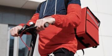 Photo by Norma Mortenson: https://www.pexels.com/photo/man-in-red-and-black-jacket-holding-black-and-red-scooter-4393256/