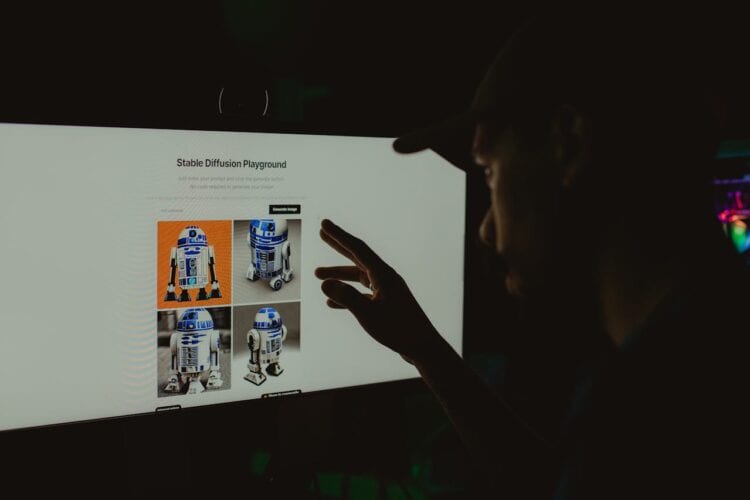 Photo by Alberlan  Barros: https://www.pexels.com/photo/man-hand-over-robot-on-screen-16018142/