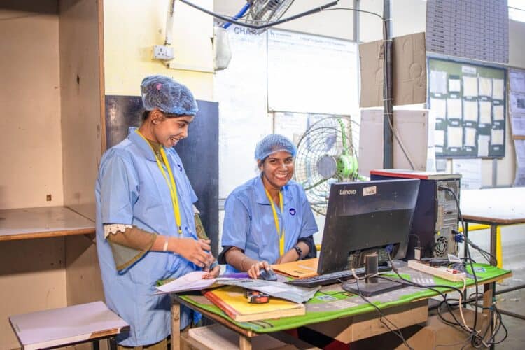 Photo by EqualStock IN: https://www.pexels.com/photo/smiling-factory-workers-at-textile-station-31047142/