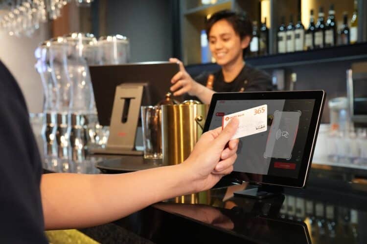 Photo by iMin Technology: https://www.pexels.com/photo/a-close-up-shot-of-a-person-having-a-card-payment-12935071/