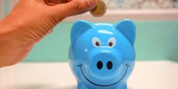 Photo by maitree rimthong: https://www.pexels.com/photo/person-putting-coin-in-a-piggy-bank-1602726/
