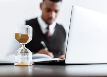 Photo by Thirdman  : https://www.pexels.com/photo/man-in-black-suit-jacket-sitting-beside-table-with-macbook-pro-5060979/