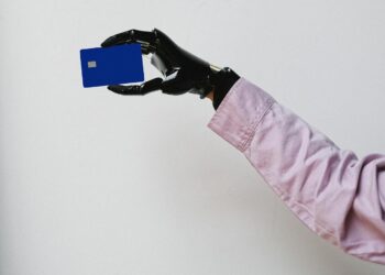 Photo by Anna Shvets: https://www.pexels.com/photo/a-person-holding-a-bank-card-5614107/