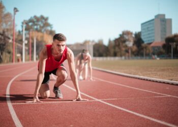 Photo by Andrea Piacquadio: https://www.pexels.com/photo/strong-sportsmen-ready-for-running-on-stadium-3764011/
