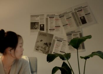 Photo by Ron Lach : https://www.pexels.com/photo/woman-sitting-and-looking-away-with-job-postings-pinned-on-wall-9841350/