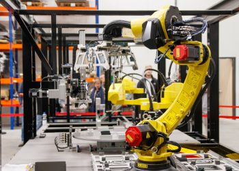 Photo by Freek Wolsink: https://www.pexels.com/photo/industrial-robot-arm-in-a-manufacturing-facility-34207359/
