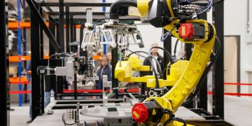 Photo by Freek Wolsink: https://www.pexels.com/photo/industrial-robot-arm-in-a-manufacturing-facility-34207359/