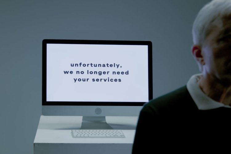 Photo by Ron Lach : https://www.pexels.com/photo/part-of-a-body-of-an-elderly-man-and-behind-screen-with-information-that-he-is-not-needed-anymore-9830817/