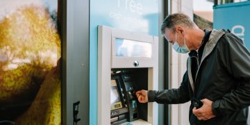Photo by Centre for Ageing Better: https://www.pexels.com/photo/man-using-atm-machine-11284045/
