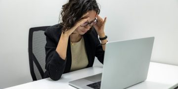 Photo by Resume Genius: https://www.pexels.com/photo/tired-young-female-employee-feeling-stressed-headache-and-burnout-from-computer-work-18848928/