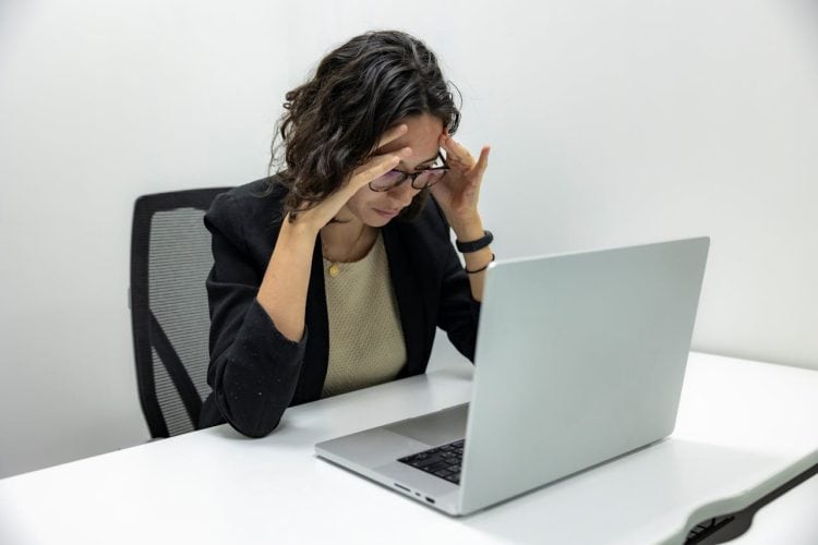 Photo by Resume Genius: https://www.pexels.com/photo/tired-young-female-employee-feeling-stressed-headache-and-burnout-from-computer-work-18848928/