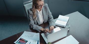 Photo by Tima Miroshnichenko: https://www.pexels.com/photo/woman-in-gray-blazer-typing-on-a-macbook-5717069/