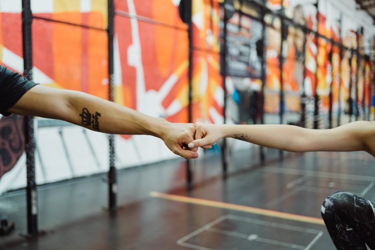 Photo by Ketut Subiyanto: https://www.pexels.com/photo/man-and-woman-bumping-fists-on-gym-4853326/