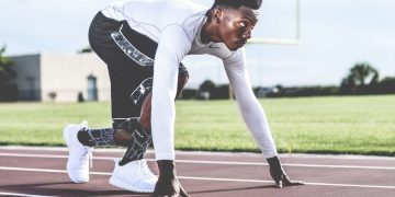 Photo by nappy: https://www.pexels.com/photo/man-wearing-white-sweater-and-black-shorts-about-to-run-936094/