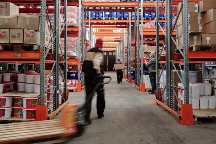 Photo by Tiger Lily: https://www.pexels.com/photo/photo-of-men-working-in-a-warehouse-4483860/