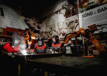 Photo by Hoang NC from Pexels: https://www.pexels.com/photo/men-in-protective-uniform-welding-with-robot-in-workshop-15888223/