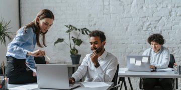 Photo by olia danilevich: https://www.pexels.com/photo/coworkers-sharing-ideas-at-work-5313161/