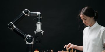 Photo by Pavel Danilyuk from Pexels: https://www.pexels.com/photo/woman-in-white-shirt-playing-chess-against-a-robot-8438951/
