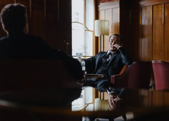 Photo by cottonbro studio from Pexels: https://www.pexels.com/photo/man-in-black-suit-blazer-sitting-on-chair-9208564/