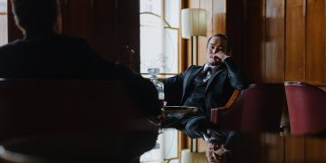 Photo by cottonbro studio from Pexels: https://www.pexels.com/photo/man-in-black-suit-blazer-sitting-on-chair-9208564/